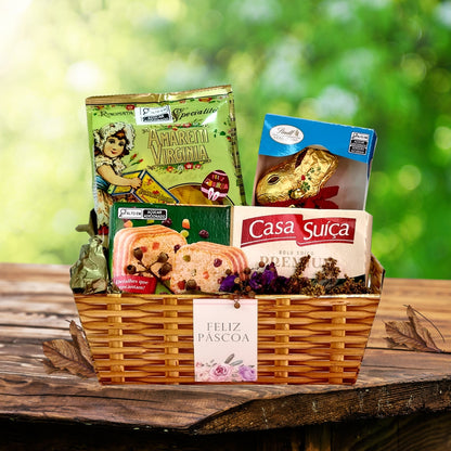 Cesta de presente de Páscoa da Maria Madame com biscoito italiano de amêndoas, coelho de chocolate da lindt  e bolo de frutas da Casa Suiça.